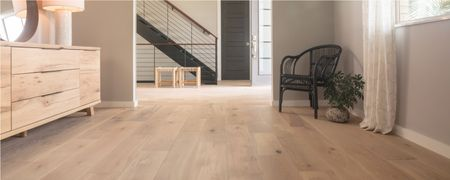 Light wood flooring flowing naturally from one room to another | Colonial Interiors